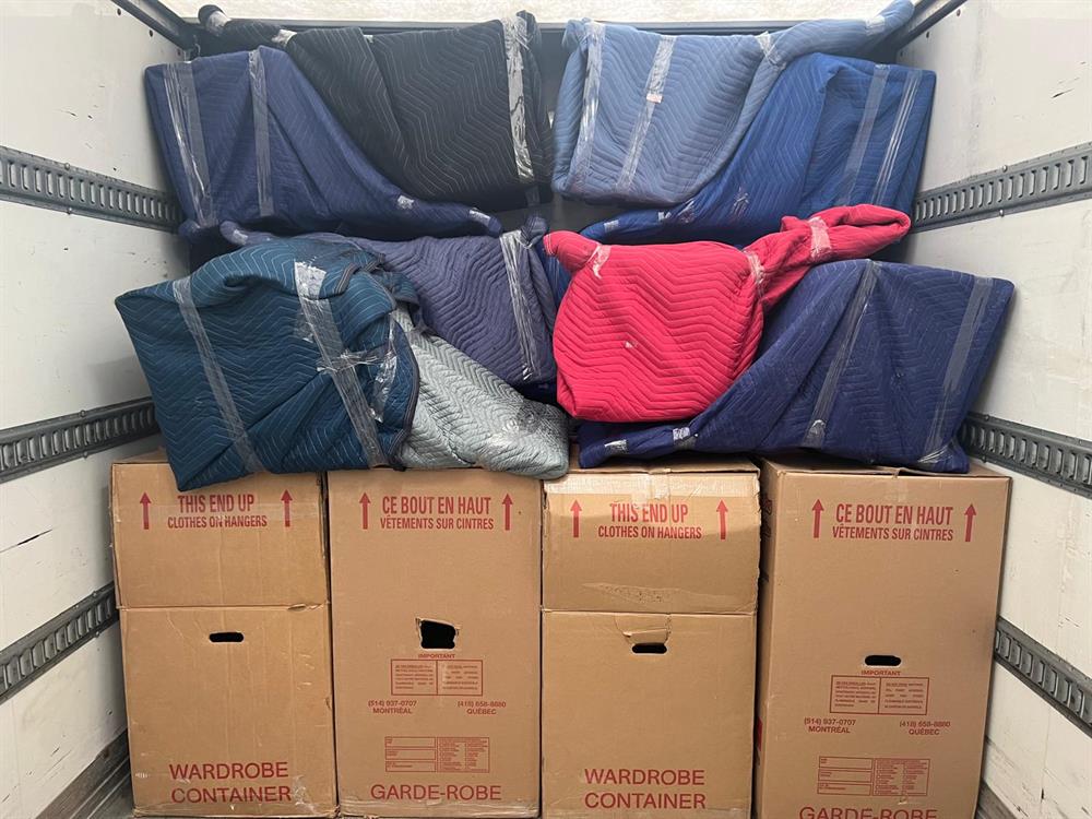 Wardrobe boxes lined up and ready before loading