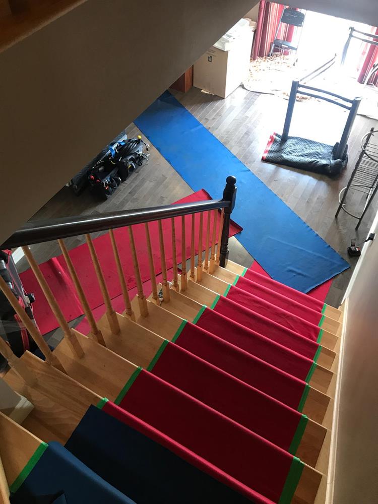 Moving truck parked in front of a home with the ramp out